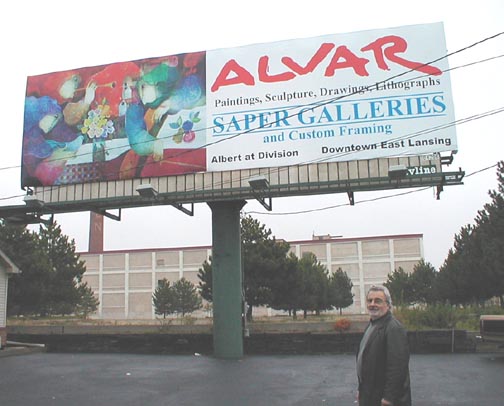 Alvar in
                            front of billboard