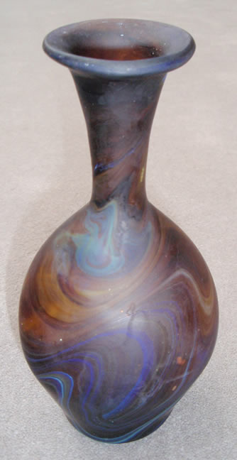Wide Base Extended Neck
                    Vase