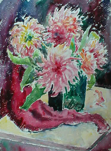 Red Orange Flowers In Vase With Red Cloth On
                    Table