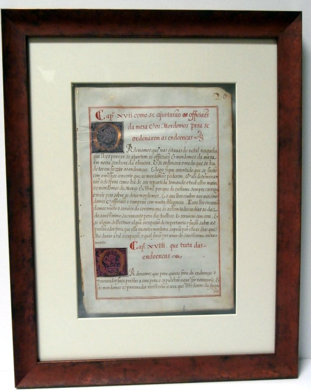 Ancient illuminated
                manuscript framed to view front and back sides